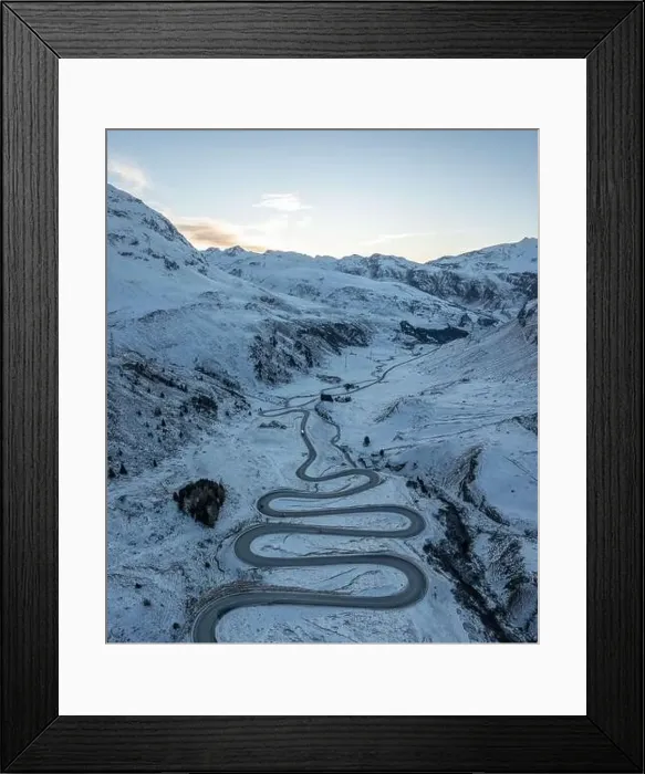 Framed Print : A snake shaped pass road in winter photographed from above Framed Print : A snake shaped pass road in winter photographed from above