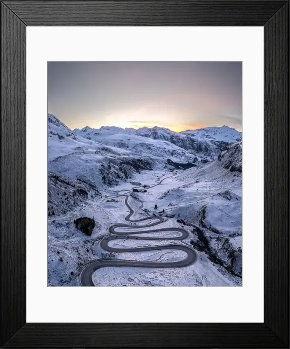 Framed Print : A snake shaped pass road in winter photographed from above Framed Print : A snake shaped pass road in winter photographed from above