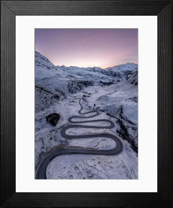 Framed Print : A snake shaped pass road in winter photographed from above Framed Print : A snake shaped pass road in winter photographed from above