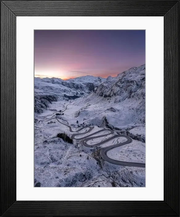Framed Print : A snake shaped pass road in winter photographed from above Framed Print : A snake shaped pass road in winter photographed from above