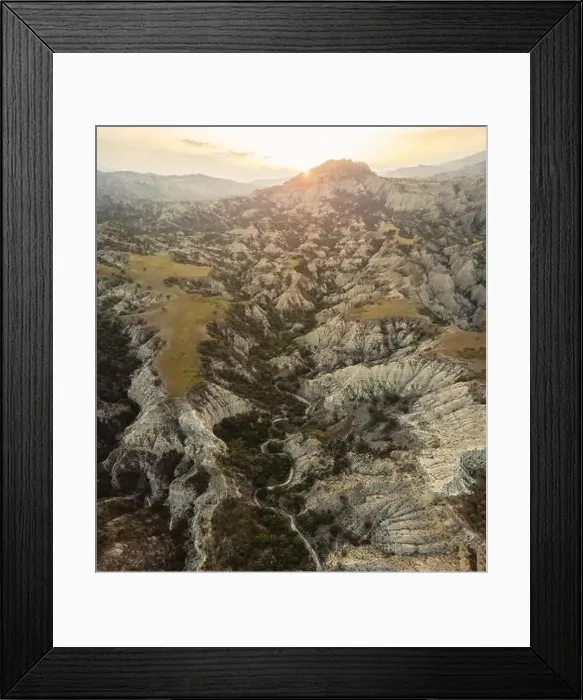 Framed Print : Surreal dramatic deserted earth landscape panorama with beautiful cliff formations Framed Print : Surreal dramatic deserted earth landscape panorama with beautiful cliff formations