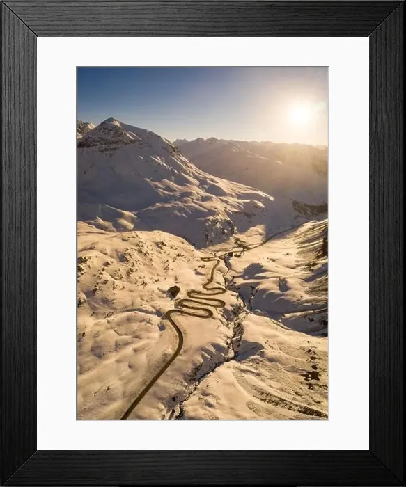 Framed Print : Snake shaped pass road in winter during sunset Framed Print : Snake shaped pass road in winter during sunset