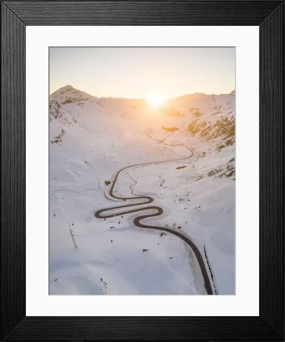 Framed Print : Snake shaped pass road in winter during sunset Framed Print : Snake shaped pass road in winter during sunset