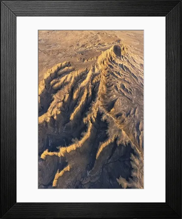 Framed Print : From above drone view of picturesque scenery with rough rocky formations and dry land in North Caineville Mesa Framed Print : From above drone view of picturesque scenery with rough rocky formations and dry land in North Caineville Mesa