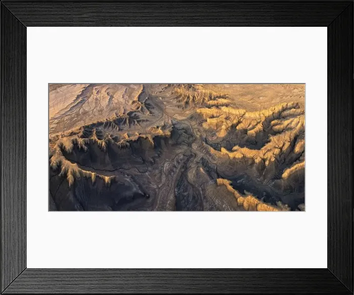 Framed Print : From above drone view of picturesque scenery with rough rocky formations and dry land in North Caineville Mesa Framed Print : From above drone view of picturesque scenery with rough rocky formations and dry land in North Caineville Mesa