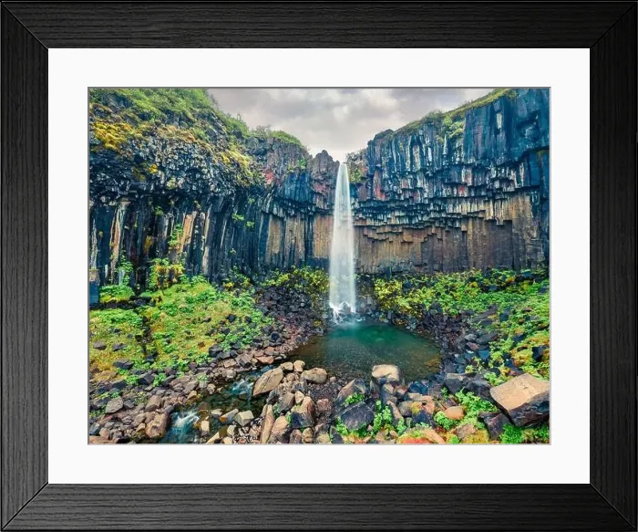 Framed Print : Aerial landscape photography. Fresh green view from flying drone of famous Svartifoss Waterfall Framed Print : Aerial landscape photography. Fresh green view from flying drone of famous Svartifoss Waterfall