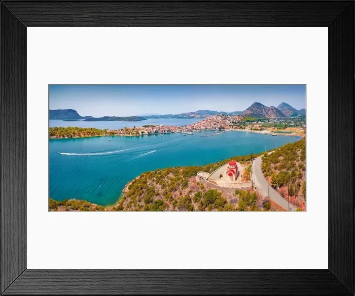 Framed Print : Stunning summer cityscape of Ermioni port and Greek Orthodox church St Framed Print : Stunning summer cityscape of Ermioni port and Greek Orthodox church St