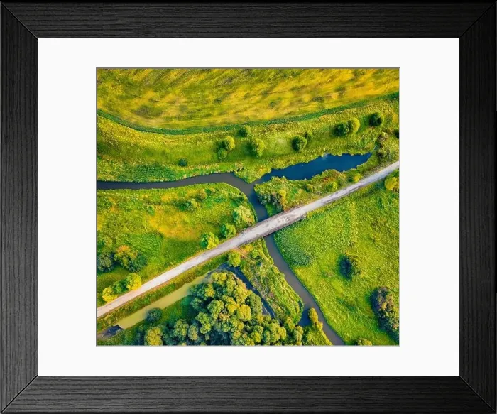 Framed Print : Straight dawn view from flying drone of bridge over small river Framed Print : Straight dawn view from flying drone of bridge over small river