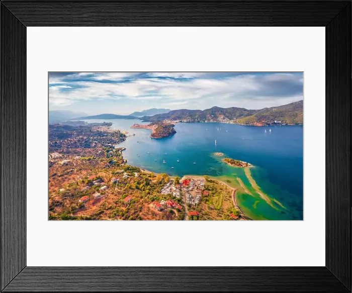 Framed Print : Spectacular summer view of Plaka beach and Poros town on background Framed Print : Spectacular summer view of Plaka beach and Poros town on background
