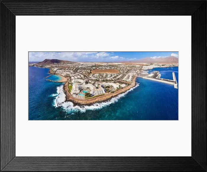 Framed Print : Lanzarote island, Playa Blanca resort. aerial drone panoramic view. Canary islands of Spain Framed Print : Lanzarote island, Playa Blanca resort. aerial drone panoramic view. Canary islands of Spain