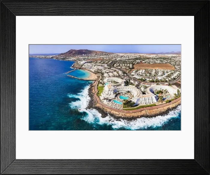 Framed Print : Lanzarote island, Playa Blanca resort. aerial drone panoramic view. Canary islands of Spain Framed Print : Lanzarote island, Playa Blanca resort. aerial drone panoramic view. Canary islands of Spain