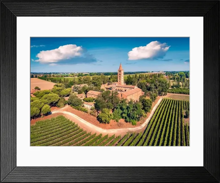 Framed Print : Wonderful summer view of Pomposa Abbey tower among the green vineyards Framed Print : Wonderful summer view of Pomposa Abbey tower among the green vineyards