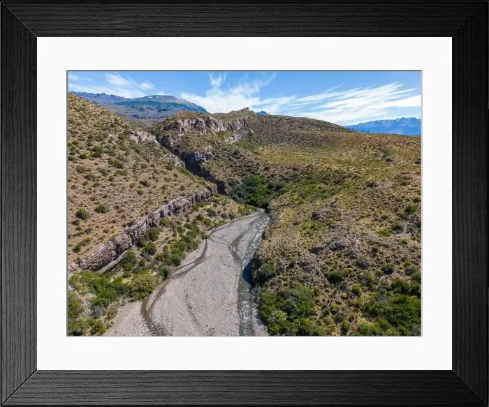 Framed Print : Aerial view of a creek running through the gorge of Quebrada El Diablo in Chile - Traveling on the Carretera Austral Framed Print : Aerial view of a creek running through the gorge of Quebrada El Diablo in Chile - Traveling on the Carretera Austral