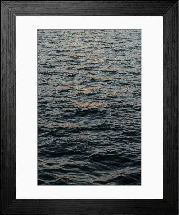 Framed Print : The stunning beauty of the ocean at sunset, with its rolling waves creating a textured and dynamic surface Framed Print : The stunning beauty of the ocean at sunset, with its rolling waves creating a textured and dynamic surface