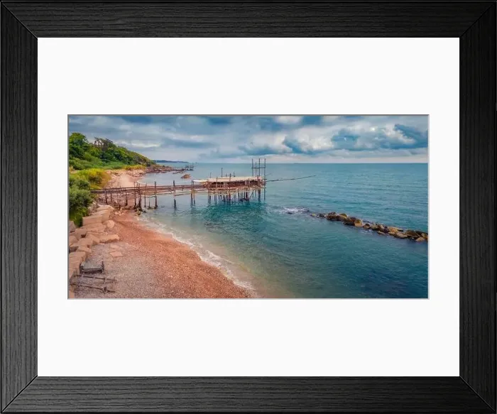 Framed Print : Gloomy summer view from flying drone of popular tourist attraction - Trabocco Turchino Framed Print : Gloomy summer view from flying drone of popular tourist attraction - Trabocco Turchino
