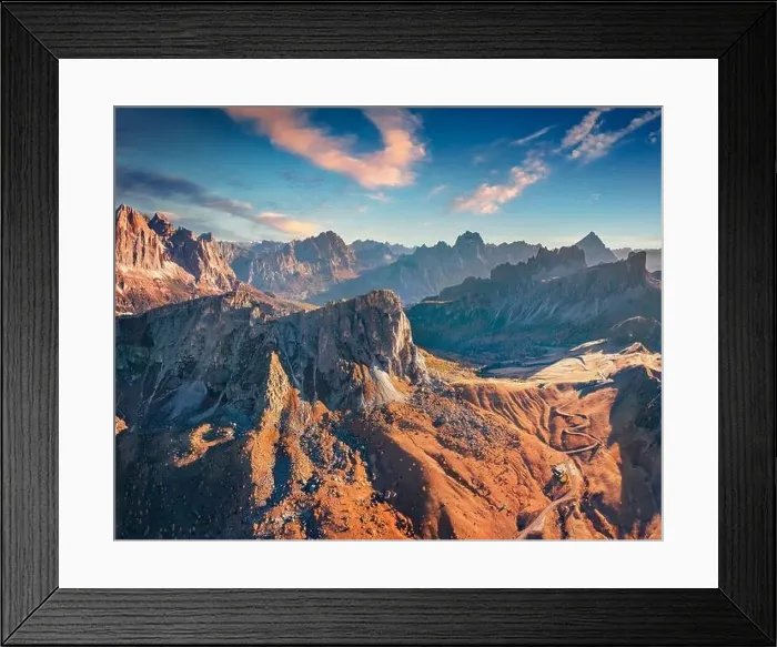 Framed Print : Aerial view from flying drone of winding Giau pass road with Ra Gusela peak Framed Print : Aerial view from flying drone of winding Giau pass road with Ra Gusela peak