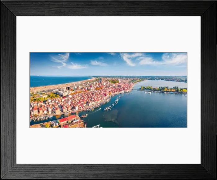 Framed Print : Astonishing summer view from flying drone of Sottomarina town Framed Print : Astonishing summer view from flying drone of Sottomarina town