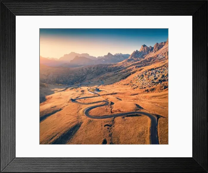 Framed Print : View from flying drone of winding road in Dolomite Alps Framed Print : View from flying drone of winding road in Dolomite Alps