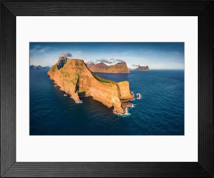 Framed Print : Dramatic summer view from flying droneof Kallur Lighthouse on Kalsoy island Framed Print : Dramatic summer view from flying droneof Kallur Lighthouse on Kalsoy island