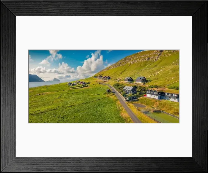 Framed Print : Sunny summer view from flying droneof Kirkjubour village with Hestur Island on background Framed Print : Sunny summer view from flying droneof Kirkjubour village with Hestur Island on background