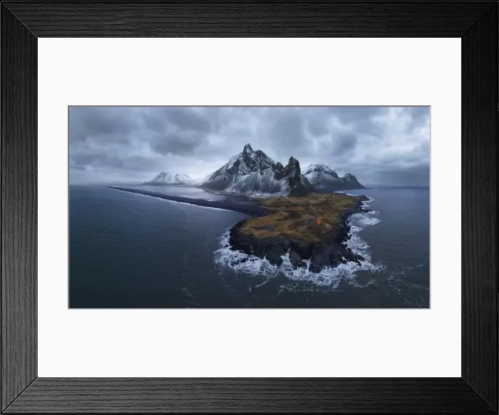 Framed Print : To aerial view of lighthouse located on south coast of Iceland near waving blue water against cloudy sky in Eystrahorn Framed Print : To aerial view of lighthouse located on south coast of Iceland near waving blue water against cloudy sky in Eystrahorn