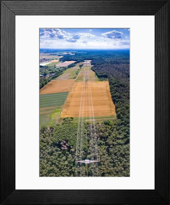 Framed Print : Aerial view along a power line in forest area with metal power poles and high voltage wires in Germany Framed Print : Aerial view along a power line in forest area with metal power poles and high voltage wires in Germany