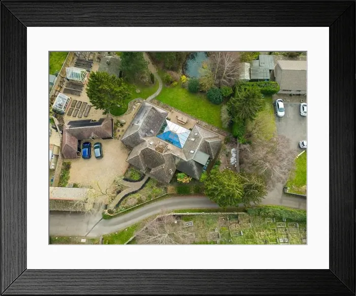 Framed Print : Aerial view of a large, detached bungalow with a large garden and pond Framed Print : Aerial view of a large, detached bungalow with a large garden and pond
