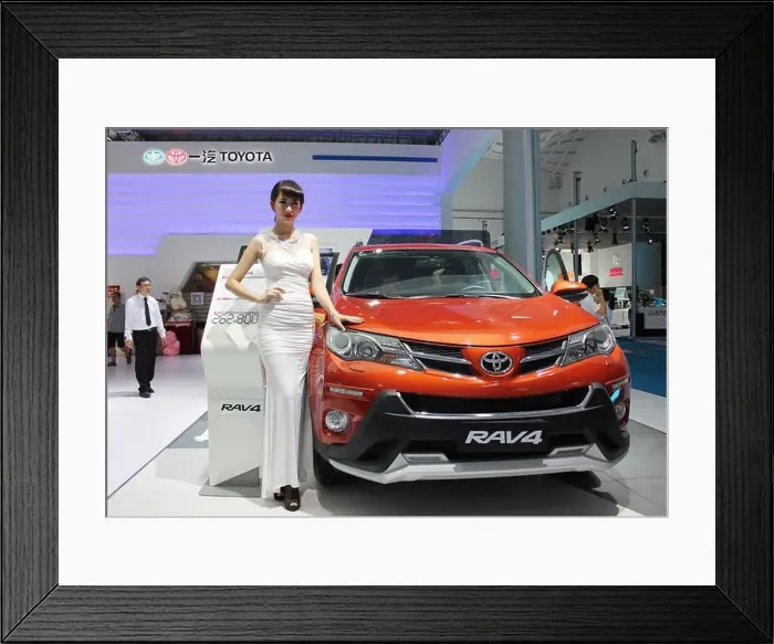 Framed Print : FILE--A Chinese model poses with a Toyota RAV4 SUV of FAW-Toyota Framed Print : FILE--A Chinese model poses with a Toyota RAV4 SUV of FAW-Toyota