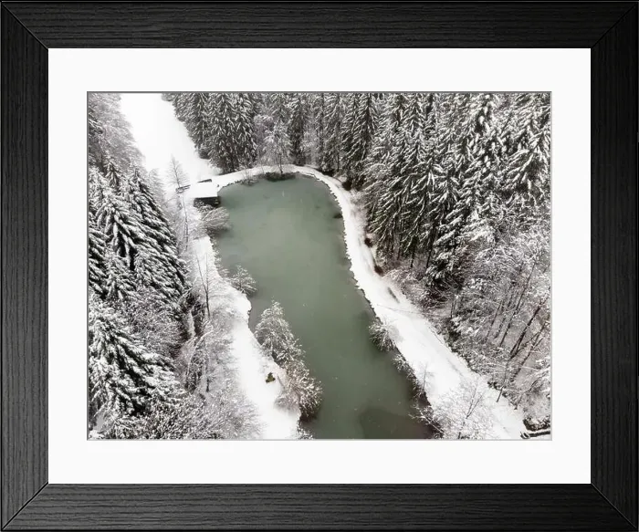 Framed Print : Pond with snowy forest. Winter season. Aerial view Framed Print : Pond with snowy forest. Winter season. Aerial view