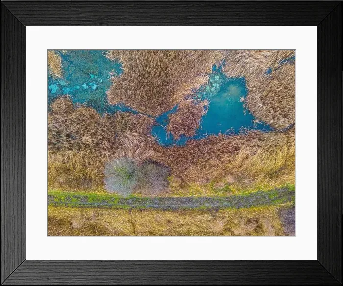 Framed Print : An aerial shot of the landscape with small lake surrounded by trees and field Framed Print : An aerial shot of the landscape with small lake surrounded by trees and field