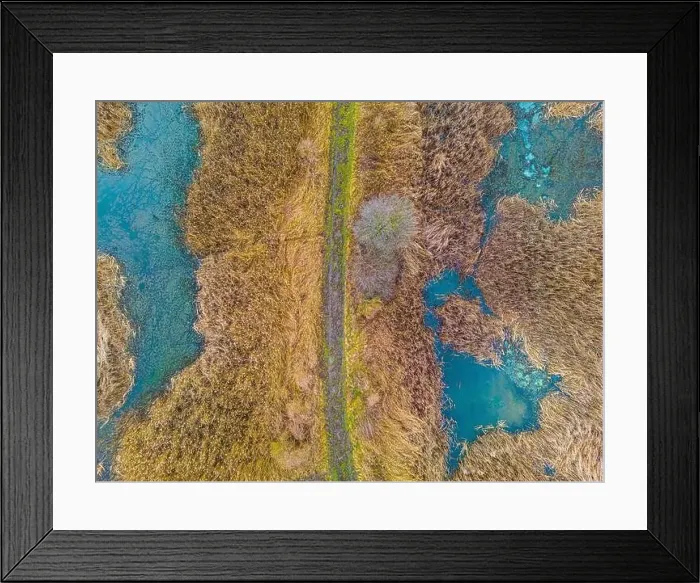 Framed Print : An aerial shot of the landscape with small lake surrounded by trees and field Framed Print : An aerial shot of the landscape with small lake surrounded by trees and field