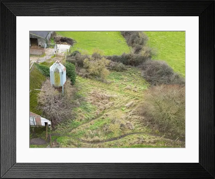 Framed Print : Aerial view of a now derelict dairy farm showing the large metallic grain hopper and some barn sheds Framed Print : Aerial view of a now derelict dairy farm showing the large metallic grain hopper and some barn sheds