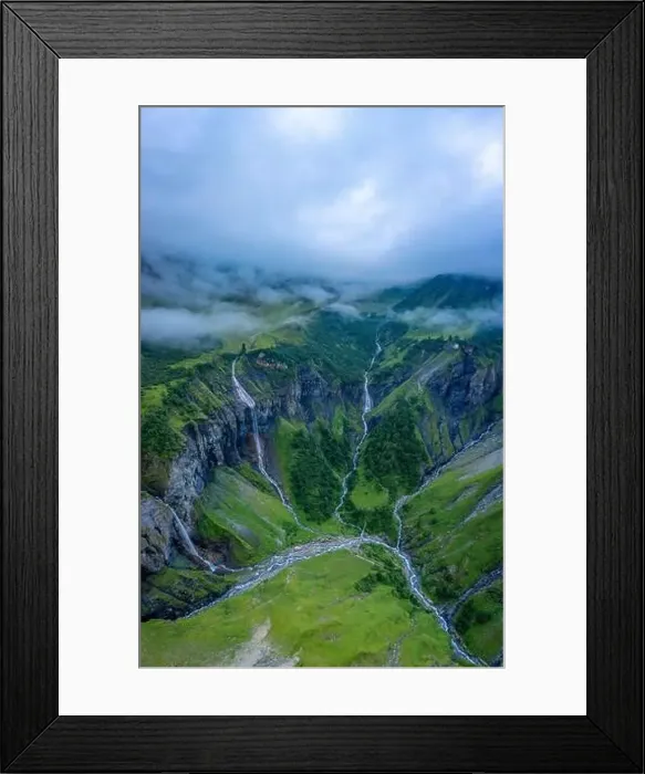 Framed Print : Aerial shot of several large waterfalls cascading down a steep cliff Framed Print : Aerial shot of several large waterfalls cascading down a steep cliff