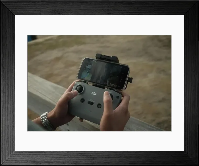 Framed Print : Image of DJI Drone Controller with iPhone - Brighton Beach, Victoria - 28 February 2023 Framed Print : Image of DJI Drone Controller with iPhone - Brighton Beach, Victoria - 28 February 2023