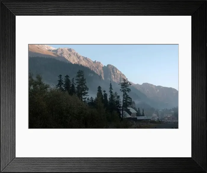 Framed Print : Sunrise above mountains and growing trees Framed Print : Sunrise above mountains and growing trees