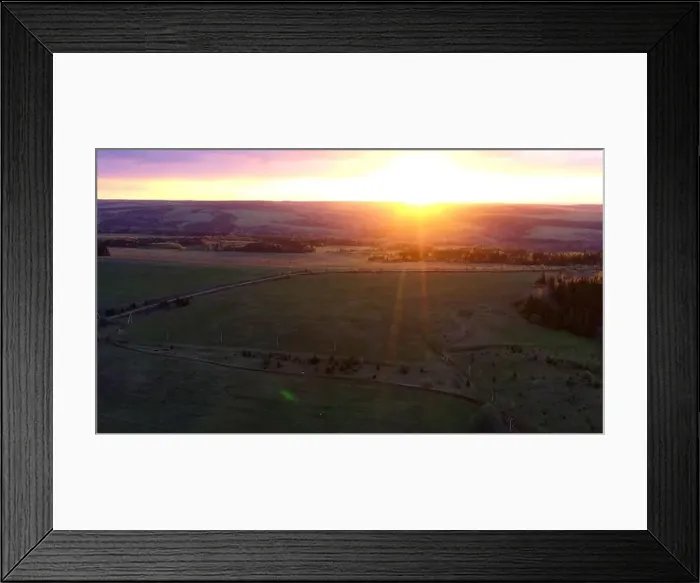 Framed Print : Aerial cinematic panoramic view of the farm field during sunset. Clip. Drone flies over agriculture green field Framed Print : Aerial cinematic panoramic view of the farm field during sunset. Clip. Drone flies over agriculture green field