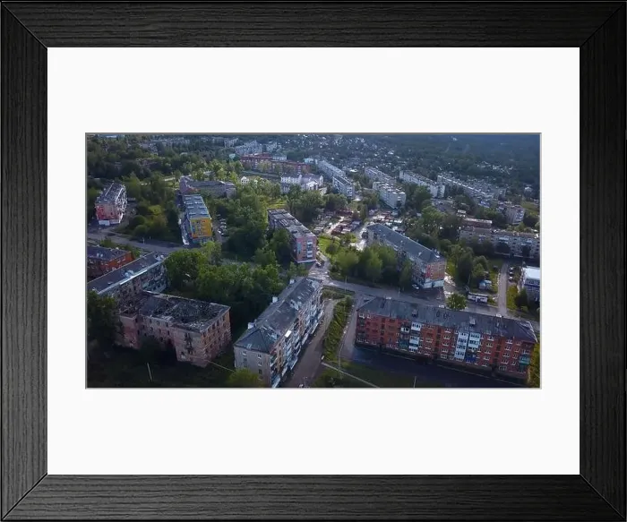 Framed Print : Top view of city in mountainous forest area Framed Print : Top view of city in mountainous forest area