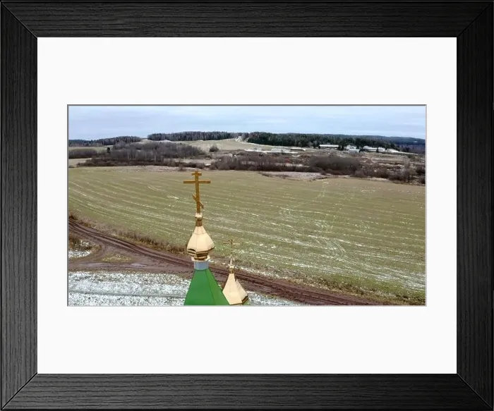 Framed Print : Initial winter. Clip.View from a drone on a landscape with snowy grass in a field where there is a temple with a golden Framed Print : Initial winter. Clip.View from a drone on a landscape with snowy grass in a field where there is a temple with a golden