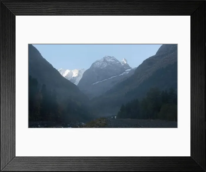 Framed Print : Valley with rocky mountains and moving fog Framed Print : Valley with rocky mountains and moving fog