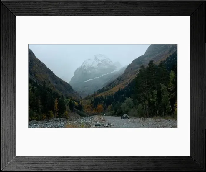 Framed Print : Big high mountains. Creative. Huge hills covered with snow and overgrown with green fir trees and pine trees around Framed Print : Big high mountains. Creative. Huge hills covered with snow and overgrown with green fir trees and pine trees around