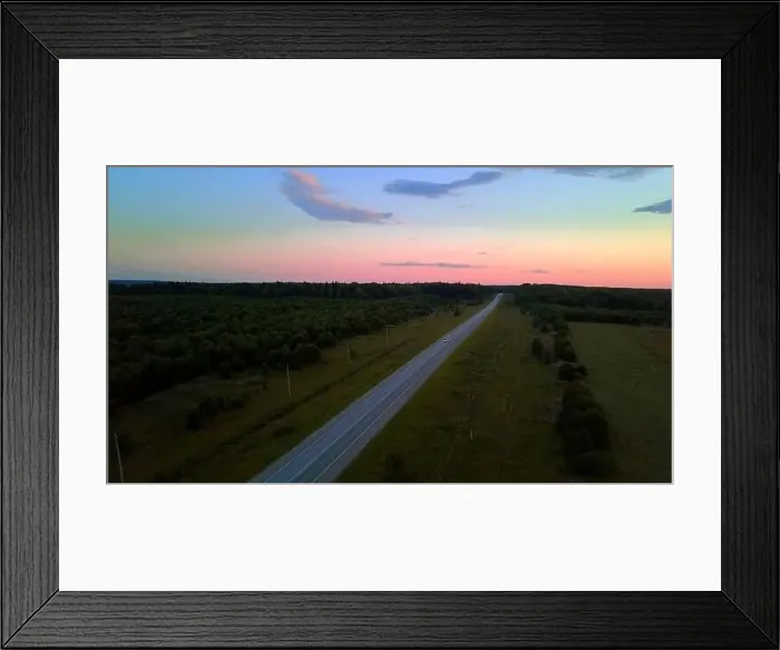 Framed Print : View from high on a colorful picturesque sky with a road Framed Print : View from high on a colorful picturesque sky with a road