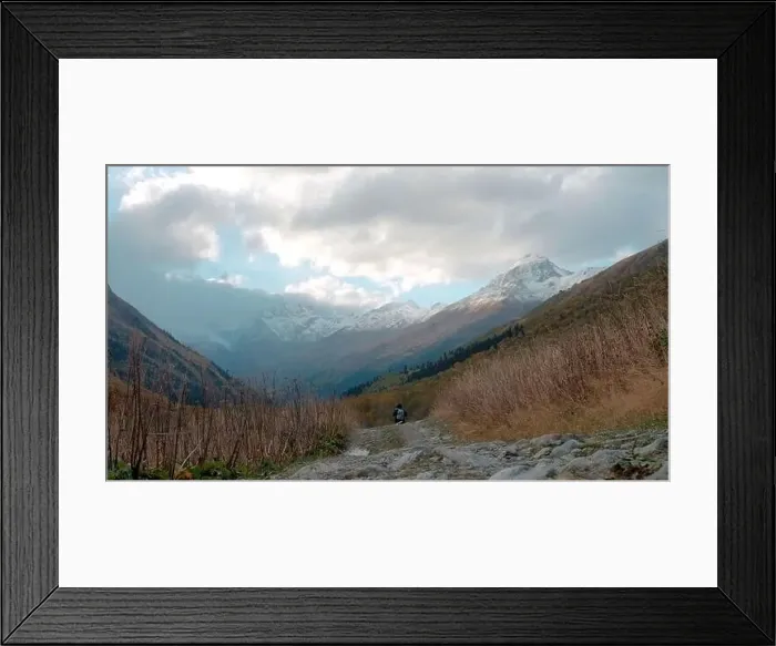Framed Print : Big high mountains. Creative. Huge hills covered with snow and overgrown with green fir trees and pine trees around Framed Print : Big high mountains. Creative. Huge hills covered with snow and overgrown with green fir trees and pine trees around