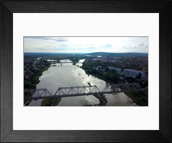 Framed Print : A summer tourist town with a river Framed Print : A summer tourist town with a river
