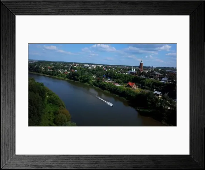 Framed Print : A summer tourist town with a river Framed Print : A summer tourist town with a river