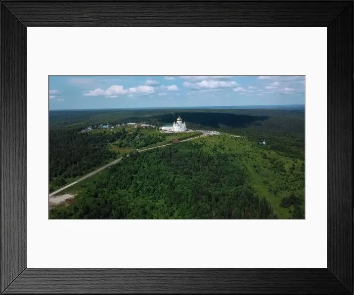 Framed Print : View from a height of a summer landscape with a forest and mountains Framed Print : View from a height of a summer landscape with a forest and mountains