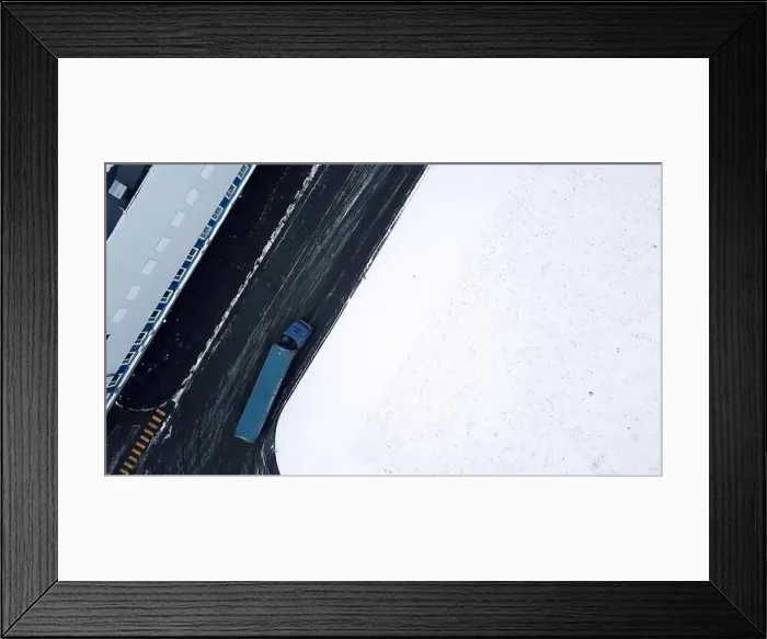 Framed Print : Moving a huge blue truck. Bird's-eye view Framed Print : Moving a huge blue truck. Bird's-eye view