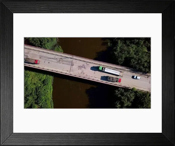Framed Print : A view over a place for cars to move over a dirty river Framed Print : A view over a place for cars to move over a dirty river
