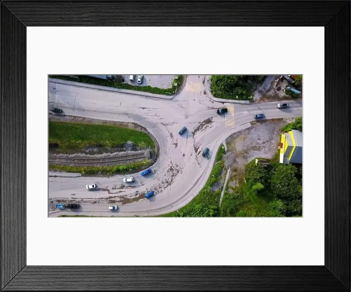 Framed Print : Aerial view of the concrete road leading to the industrial zone. Clip. Cars driving near green summer trees Framed Print : Aerial view of the concrete road leading to the industrial zone. Clip. Cars driving near green summer trees