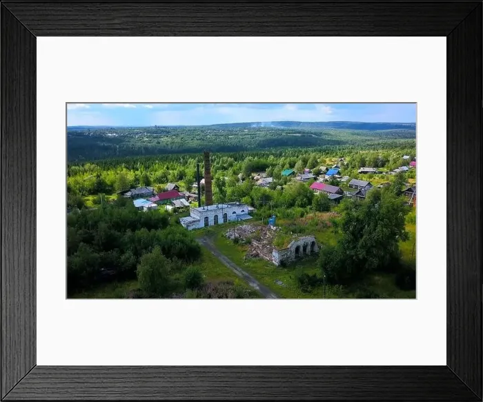 Framed Print : Aerial view of a village located by the river shore. Clip. Flying above summer green nature and buildings Framed Print : Aerial view of a village located by the river shore. Clip. Flying above summer green nature and buildings