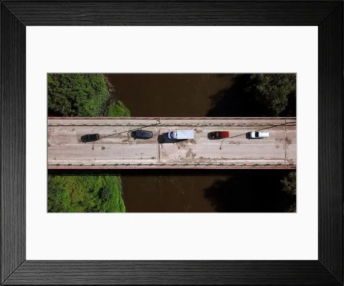 Framed Print : The bridge over the river. Clip. Car traffic on the bridge, iew from the top Framed Print : The bridge over the river. Clip. Car traffic on the bridge, iew from the top